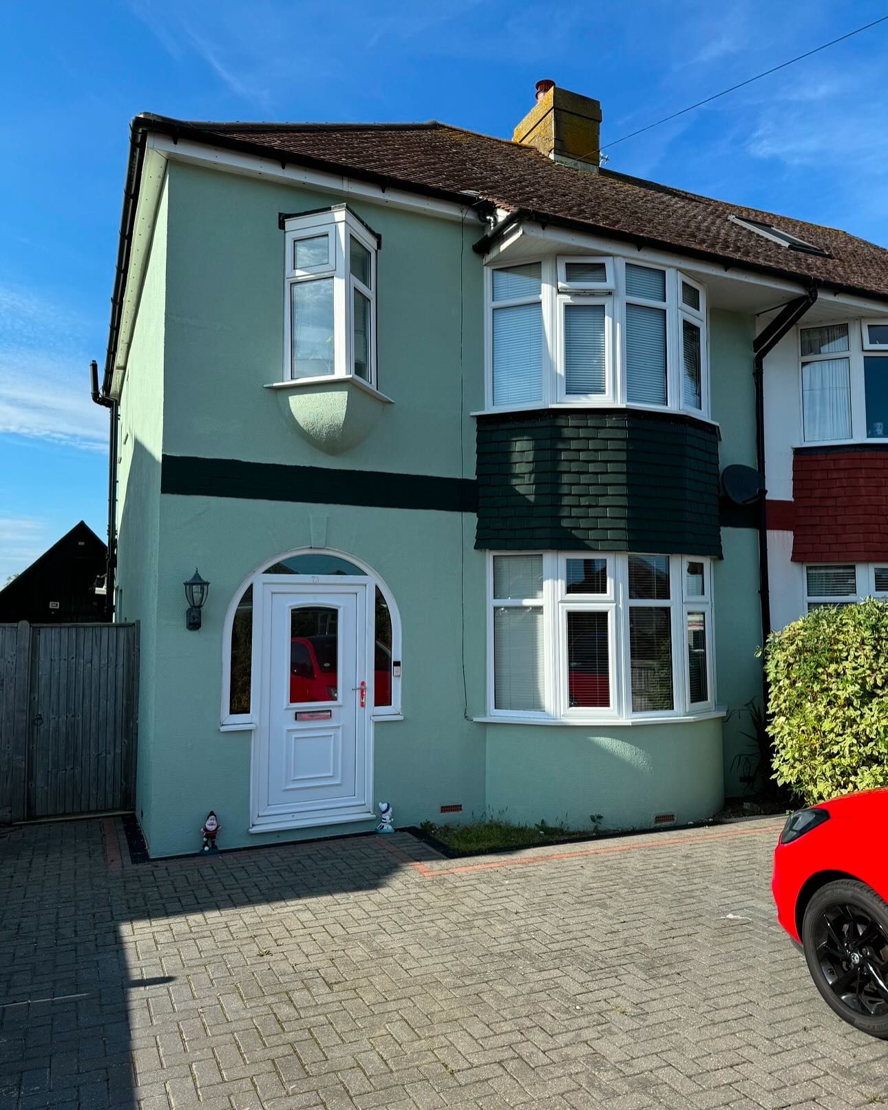 House exterior transformed with a green masonry finish
