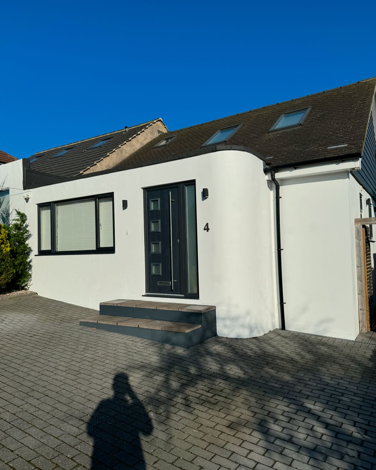 Freshly painted white bungalow exterior
