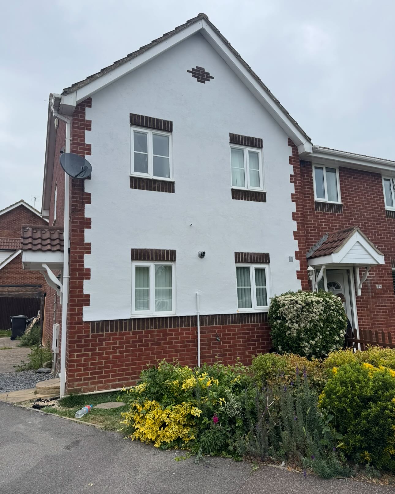 Restored smooth-render house facade finished in Frost Grey